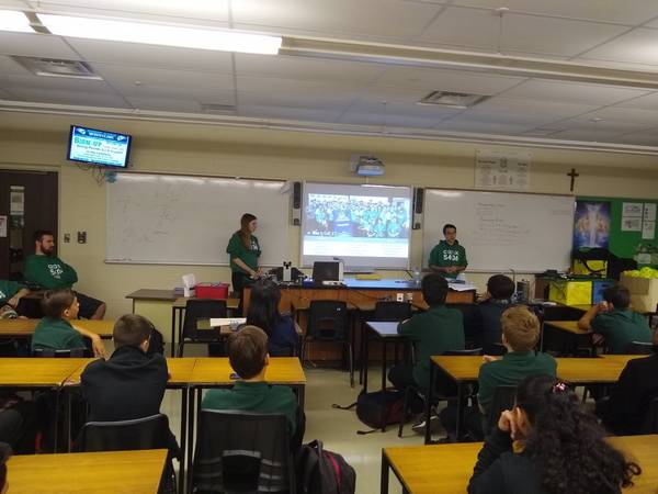 Two students giving a presentation for our first recruitment meeting